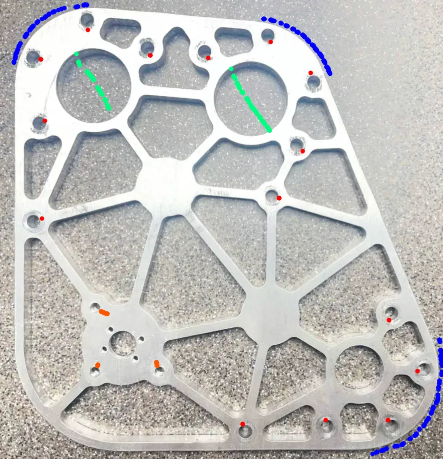 Photo of the original machined aluminum robot plate with colored marks on the 0.196 inch holes, the 1.125 inch holes, the tapped 8-32 holes, and the 30 mm outer corners