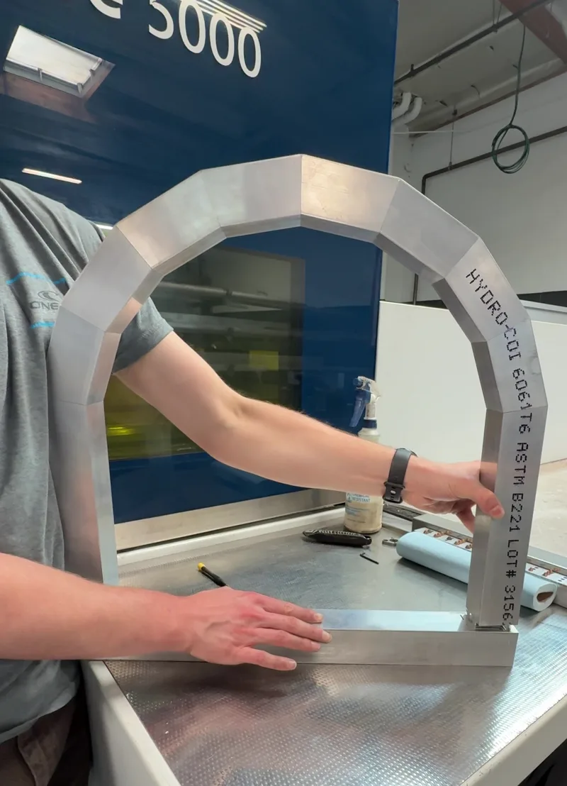 Aluminum tube arch frame with mitered joints, cut on Fabworks' tube laser
